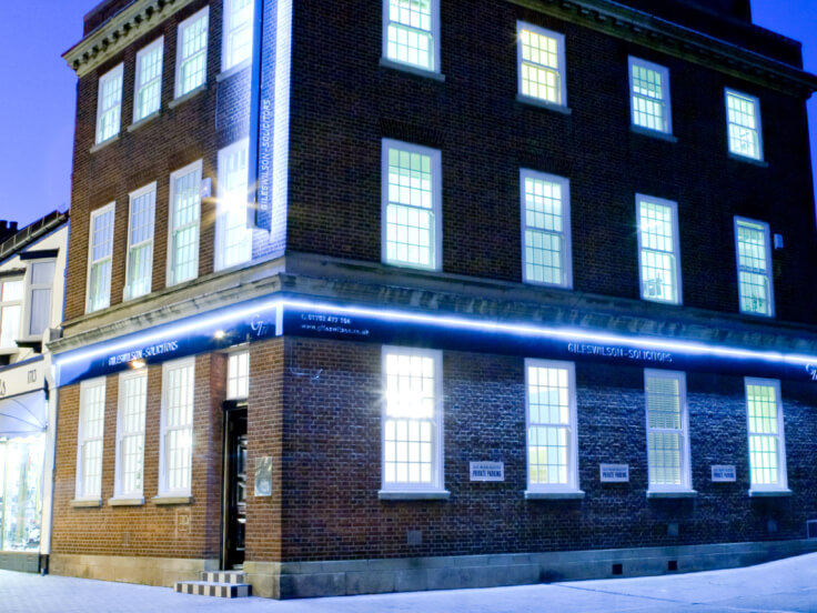 Giles Wilson head office exterior at night